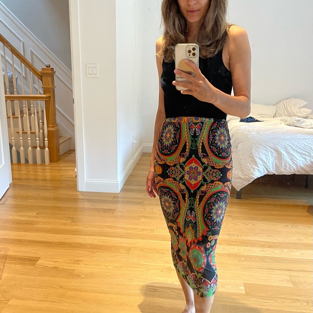 Beautiful knit pencil skirt. It runs small. You can wear it like a dress too.